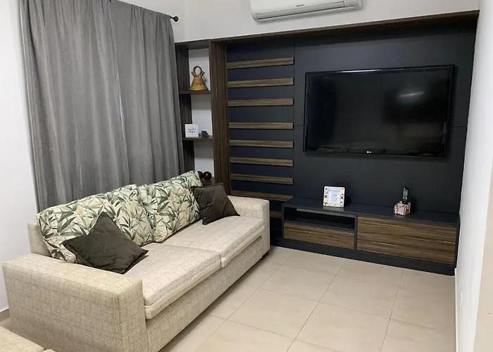 Flat em Pitangueiras - sacada gourmet, 3 dorms, limpeza diária e serv de praia Apartamento Guarujá